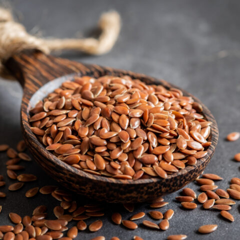 Flax seeds on wooden spoon